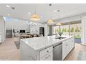 Spacious kitchen island with white cabinets and high-end appliances at 7250 W Pinnacle Vista Dr, Peoria, AZ 85383