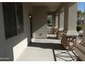 Covered front porch with stone accents and access to the front door at 8808 W State Ave, Glendale, AZ 85305