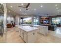 U-shaped kitchen island with stainless steel appliances and views to the Gathering room at 9771 E Roadrunner Dr, Scottsdale, AZ 85262