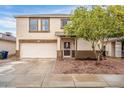 Two-story house with attached garage and landscaped front yard at 11526 W Scotts Dr, El Mirage, AZ 85335