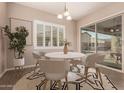 Casual breakfast nook with a white table and sliding glass doors at 1228 N 102Nd St, Mesa, AZ 85207