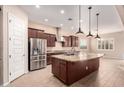 Spacious kitchen with stainless steel appliances and granite island at 1228 N 102Nd St, Mesa, AZ 85207