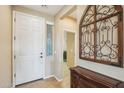 Bright entryway with a white door and decorative wall art at 12951 W Andrew Ln, Peoria, AZ 85383