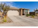 Modern single story home with a two-car garage and front yard landscaping at 19122 W Solano Dr, Litchfield Park, AZ 85340