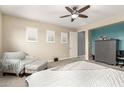 Inviting bedroom features a cozy seating area, neutral carpeting, and ample natural light at 19544 W Lincoln St, Buckeye, AZ 85326