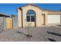 Cute single-story home with a small front yard at 20 W Whyman Ave, Avondale, AZ 85323