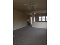 Spacious living room with neutral carpeting and high ceilings at 2636 S Sailors Way, Gilbert, AZ 85295