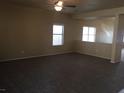 Bright living room featuring neutral walls and carpeted floors at 2636 S Sailors Way, Gilbert, AZ 85295