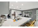 Modern kitchen with white cabinets, quartz countertops, and stainless steel appliances at 2871 S Los Altos Pl, Chandler, AZ 85286