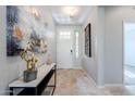 Bright and airy entryway with tile flooring and modern decor at 392 E Laddoos Ave, Queen Creek, AZ 85140