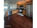 Bright kitchen with stainless steel appliances and wood flooring at 5031 N 81St St, Scottsdale, AZ 85250