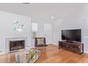 Living room features a fireplace and hardwood floors at 5210 W Jupiter N Way, Chandler, AZ 85226