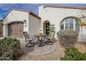 Inviting front patio with seating area and desert landscaping at 72 E Camellia Way, Queen Creek, AZ 85140