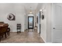 Bright and spacious entryway with tile flooring and an elegant front door at 10040 E Grandview St, Mesa, AZ 85207