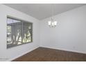 Simple dining room with hardwood floors and large window at 1320 W Palo Verde Dr, Chandler, AZ 85224