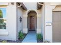 Inviting entryway with arched doorway and decorative accents at 16807 W Berkeley Rd, Goodyear, AZ 85395