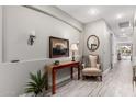 Bright and spacious entryway with elegant furniture and large mirror at 20385 W Vista Paseo Dr, Buckeye, AZ 85396