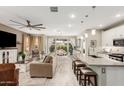 Open concept kitchen with island, stainless steel appliances, and white cabinetry at 20385 W Vista Paseo Dr, Buckeye, AZ 85396