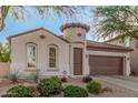 One-story home with a two-car garage and desert landscaping at 2133 E La Salle St, Phoenix, AZ 85040