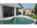 Inviting kidney-shaped pool with a spacious patio perfect for relaxation and entertaining at 2133 E La Salle St, Phoenix, AZ 85040