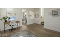 Home entryway with wood floors and view into dining area at 4132 E Santa Fe Ln, Gilbert, AZ 85297