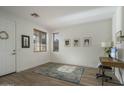 Bright home office with wood floors and built-in desk at 4132 E Santa Fe Ln, Gilbert, AZ 85297