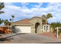 One-story house with a two-car garage, and desert landscaping at 702 E Nancy Ave, San Tan Valley, AZ 85140