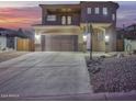 Two-story house with a large driveway and basketball hoop at 13032 N 19Th St, Phoenix, AZ 85022