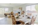 Bright dining area with a table set for four and an office space at 1722 E San Xavier Dr, Casa Grande, AZ 85122