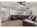 Relaxing living room featuring a large sectional sofa and neutral decor at 24758 W Huntington Dr, Buckeye, AZ 85326