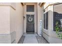 Front entry with a wreath and welcome sign at 2524 N Sunaire --, Mesa, AZ 85215