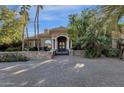 Elegant home with stone facade, gated entry, and a courtyard at 2549 E Cherrywood Pl, Chandler, AZ 85249