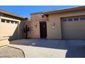 Tan stucco home featuring a decorative cactus and stone entryway at 4361 S Tigre Del Mar Dr, Gold Canyon, AZ 85118