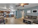 Open floor plan living room and kitchen area with tile floors at 5625 N 67Th Dr, Glendale, AZ 85303