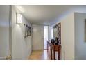 Bright and spacious entryway with wood floors and decorative accents at 10113 W Kingswood Cir, Sun City, AZ 85351