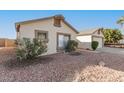 House exterior showcasing a side view and rock landscaping at 10831 W Laurie Ln, Peoria, AZ 85345