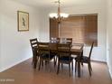 Bright dining room with wood table and six chairs at 16621 S 44Th Pl, Phoenix, AZ 85048