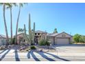 Single story home with a large front yard and desert landscaping at 17409 N Horseshoe Dr, Surprise, AZ 85374