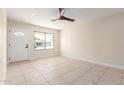 Bright living room with tile floors and ceiling fan at 17830 N 30Th St, Phoenix, AZ 85032