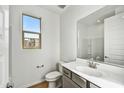 Clean bathroom with vanity, toilet and mirror at 33333 N 132Nd Dr, Peoria, AZ 85383