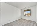 Bright bedroom with neutral walls and carpet flooring at 33333 N 132Nd Dr, Peoria, AZ 85383