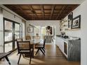 Elegant dining area with a wooden table and access to the kitchen at 61 W Wilshire Dr, Phoenix, AZ 85003