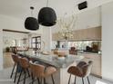 Modern kitchen with a large island and marble countertops at 61 W Wilshire Dr, Phoenix, AZ 85003