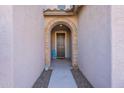 Inviting entryway with an arched doorway and tile flooring at 7067 W Maya Way, Peoria, AZ 85383