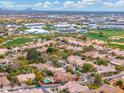 Aerial view of houses and a golf course in a residential area at 7710 E Monica Dr, Scottsdale, AZ 85255