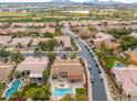 Aerial view showing a house with a pool and surrounding neighborhood at 7710 E Monica Dr, Scottsdale, AZ 85255