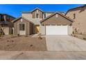 Two-story house with a white garage door and brown accents at 9242 E Sector Dr, Mesa, AZ 85212