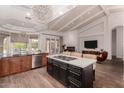 Open kitchen with large island, breakfast bar, and Gathering room access at 9053 N 46Th St, Phoenix, AZ 85028