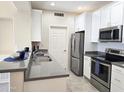 Modern kitchen with stainless steel appliances and breakfast bar at 9253 N Firebrick Dr # 210, Fountain Hills, AZ 85268