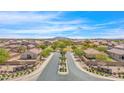 Aerial view of community entrance with signage and landscaping at 1650 E Kingman Pl, Casa Grande, AZ 85122